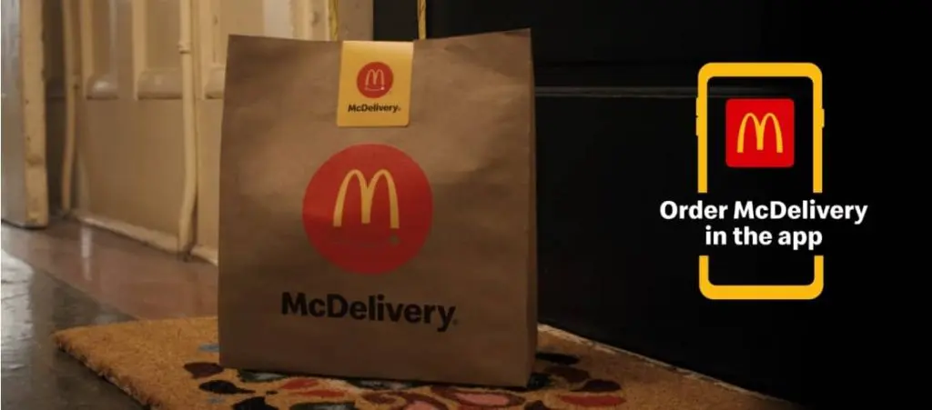 McDonald’s brand identity with McDelivery bag and app ordering promo.