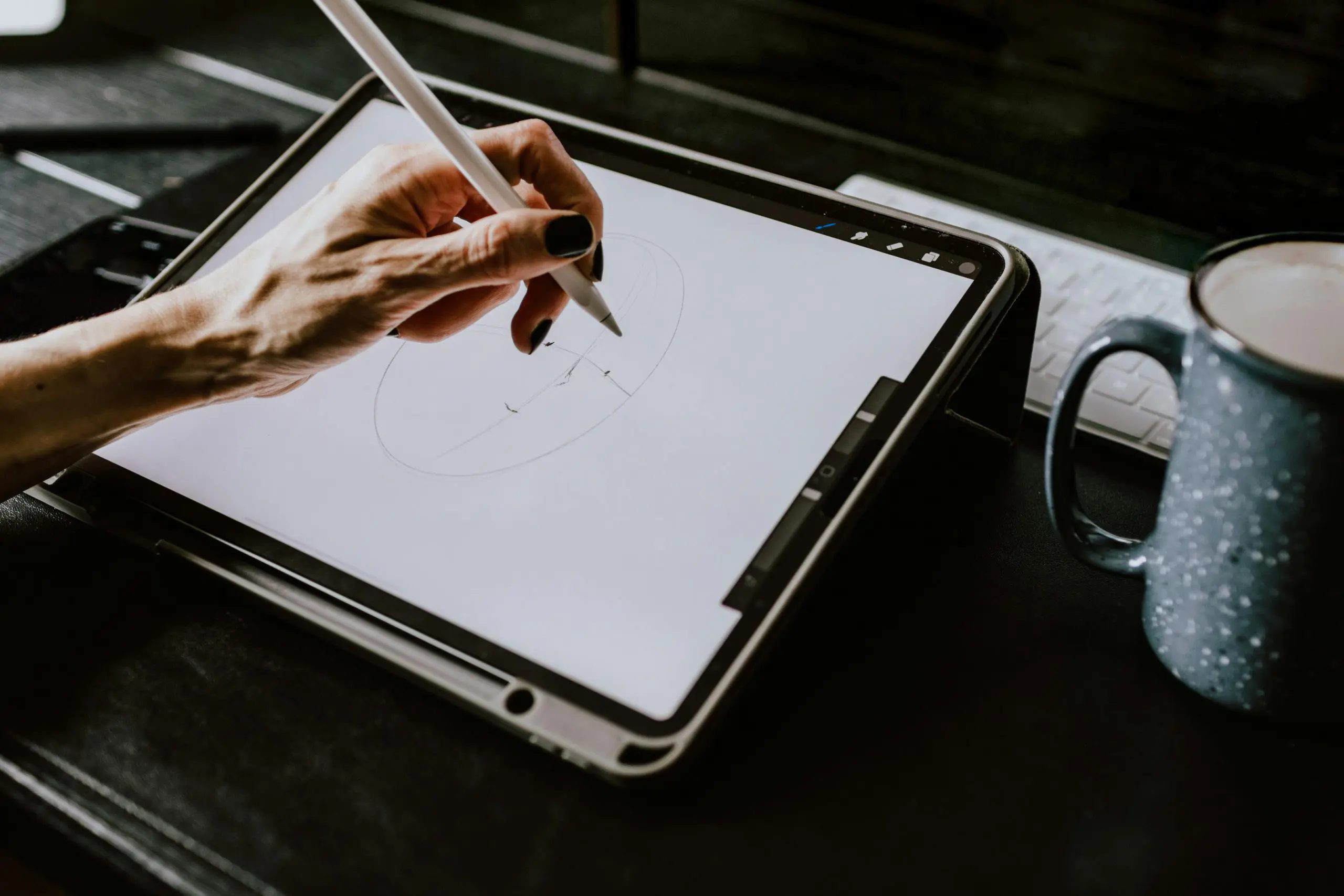 Drawing on a tablet to produce digital art.