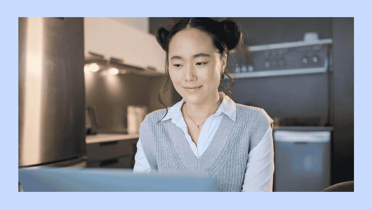 a woman looking at a laptop