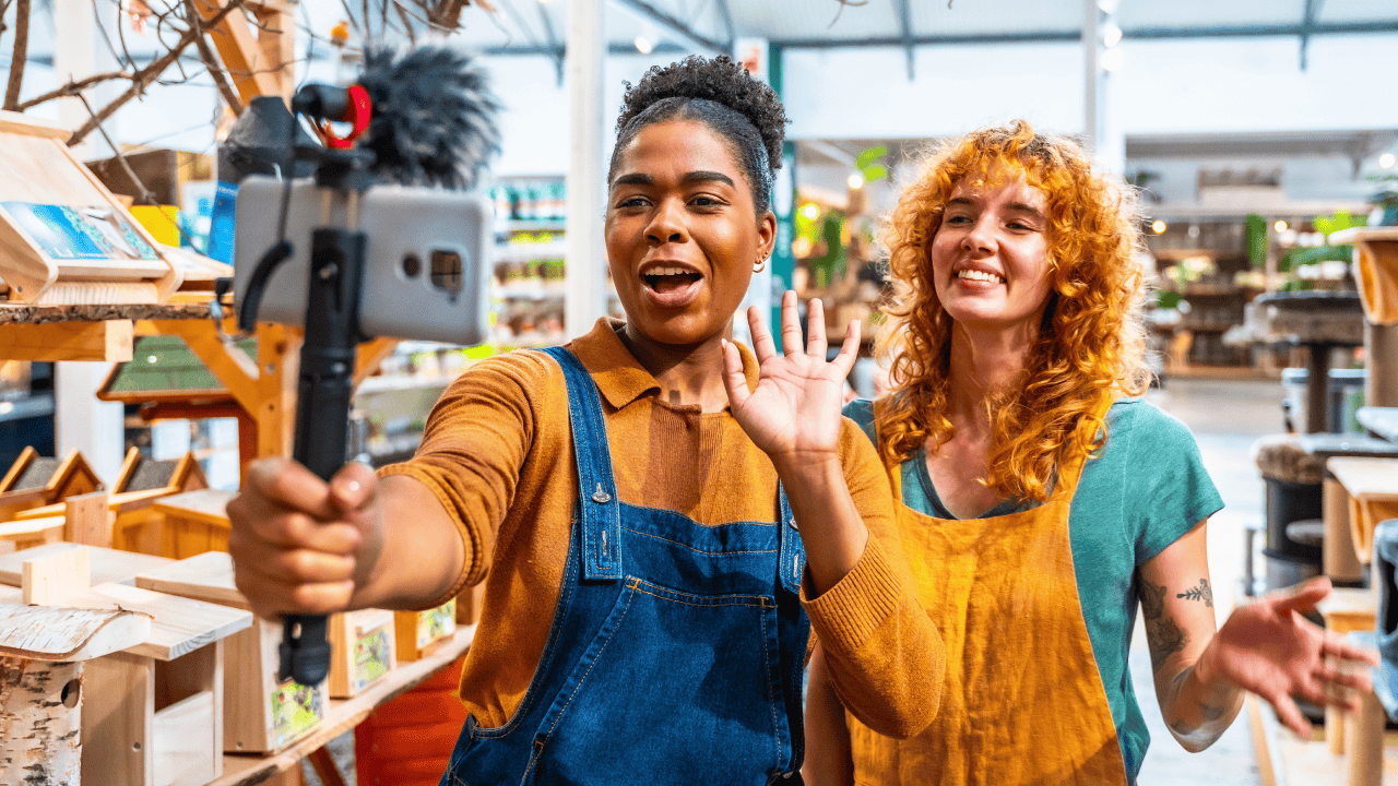 Social media video marketing: small business owners creating a video.