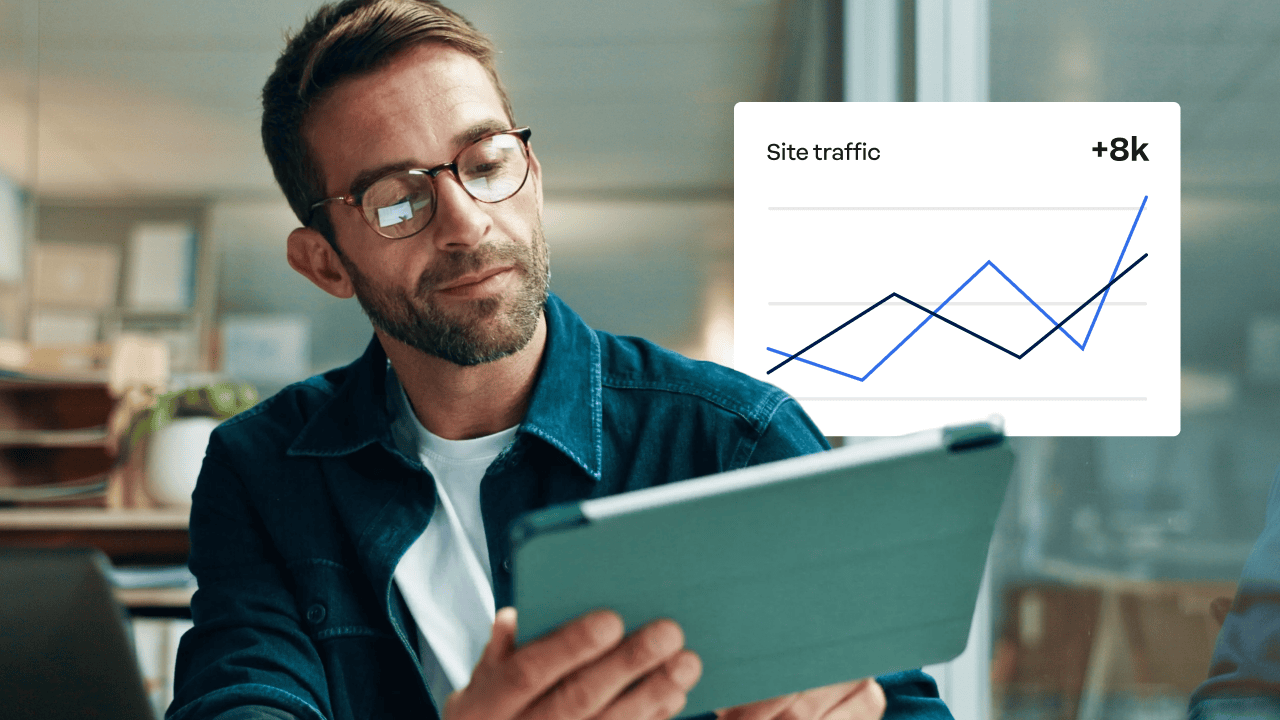 Website performance metrics: person reviewing website traffic data.