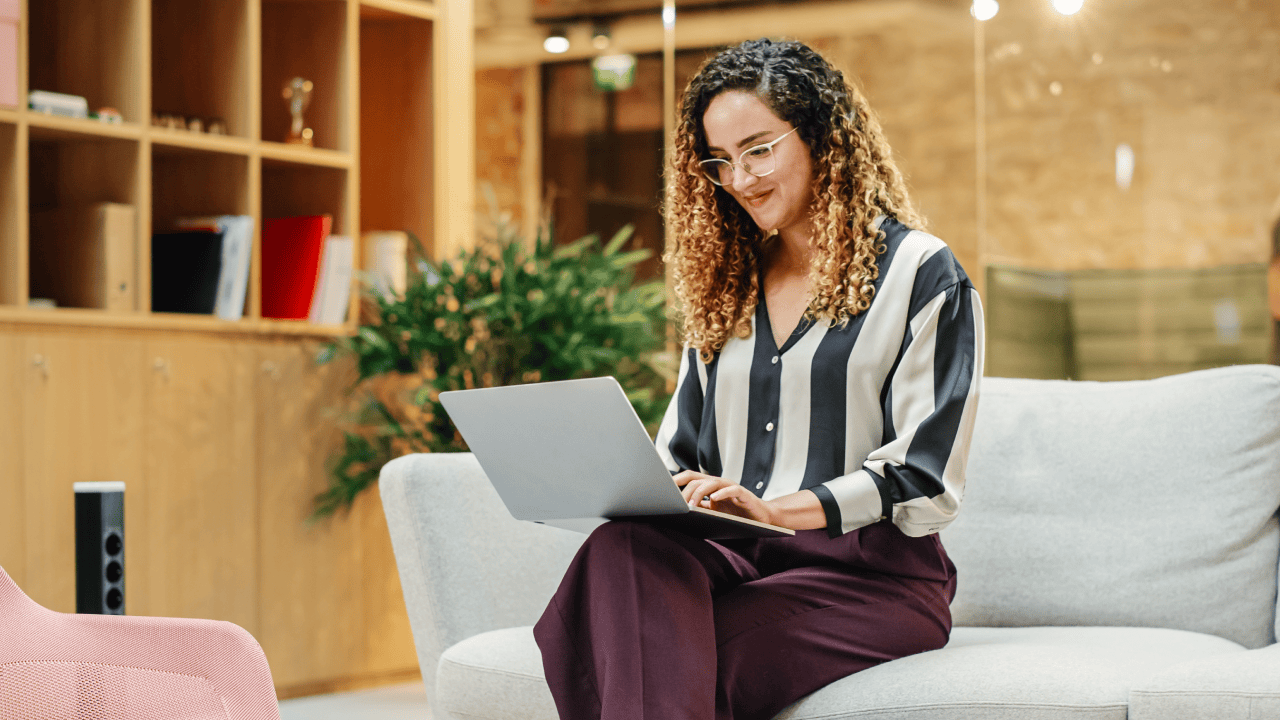 Freelancer learning how to create a portfolio website while working on a laptop.