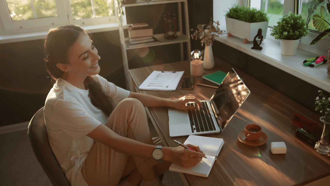 Stay-at-home mom working on a laptop and planning ways to make money from home.